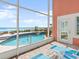 View from the screened patio to the backyard pool, spa and ocean at 1504 N Atlantic Ave, Daytona Beach, FL 32118