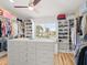 Spacious walk-in closet with custom shelving and storage solutions with a view of the backyard at 1504 N Atlantic Ave, Daytona Beach, FL 32118