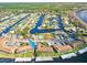 Aerial view showing community buildings, pool, and river access with docks, highlighting the waterfront living at 1640 Juno Trl # 105D, Astor, FL 32102