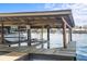 Boathouse on a lake provides secure boat storage and water access for recreational activities at 1640 Juno Trl # 105D, Astor, FL 32102