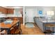 Cozy living room and kitchen with wood tile floors, perfect for entertaining guests in a relaxed atmosphere at 1640 Juno Trl # 105D, Astor, FL 32102