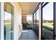 Screened-in porch with views of landscaping and a lake, creating a relaxing outdoor space at 1640 Juno Trl # 105D, Astor, FL 32102
