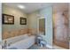 Bathroom features a soaking tub and glass-door shower at 2071 S Atlantic Ave # 1005, Daytona Beach Shores, FL 32118