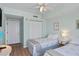 This spacious bedroom includes twin beds, soft green walls, and ample closet space at 2071 S Atlantic Ave # 1005, Daytona Beach Shores, FL 32118