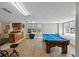 A room with a pool table and a kitchenette at 2071 S Atlantic Ave # 1005, Daytona Beach Shores, FL 32118
