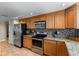 The kitchen features stainless steel appliances, granite countertops and a tile backsplash at 2071 S Atlantic Ave # 1005, Daytona Beach Shores, FL 32118