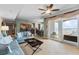 Comfortable living room with ocean views, open to kitchen, tile floors, and sliding glass door to balcony at 2071 S Atlantic Ave # 1005, Daytona Beach Shores, FL 32118