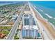 Enjoy this beautiful oceanfront view of the building near the beach, city, and Halifax River at 2071 S Atlantic Ave # 1005, Daytona Beach Shores, FL 32118