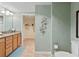 Bathroom with granite counters, updated vanity, and toilet with storage at 2071 S Atlantic Ave # 1005, Daytona Beach Shores, FL 32118