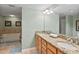 This bathroom features granite counters, double sinks, and a separate tub at 2071 S Atlantic Ave # 1005, Daytona Beach Shores, FL 32118