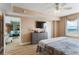 This main bedroom has a lovely ocean view, wood floors, ceiling fan and flat screen tv at 2071 S Atlantic Ave # 1005, Daytona Beach Shores, FL 32118