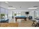 Well-lit recreation room with pool table and other games for your enjoyment at 2071 S Atlantic Ave # 1005, Daytona Beach Shores, FL 32118