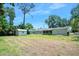 Backyard with shed, providing a view of the property's outdoor space and utility features at 241 Sanchez Ave, Ormond Beach, FL 32174