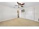 Bright bedroom with neutral carpet, mounted TV and ample closet space at 241 Sanchez Ave, Ormond Beach, FL 32174