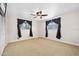 Spacious bedroom featuring neutral tones and a ceiling fan for added comfort at 241 Sanchez Ave, Ormond Beach, FL 32174
