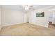 Bright bedroom with neutral carpet, attached bathroom and a mounted TV at 241 Sanchez Ave, Ormond Beach, FL 32174