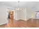 Dining room featuring wood floors and a view into the kitchen area at 241 Sanchez Ave, Ormond Beach, FL 32174