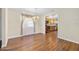 Dining room with laminate wood flooring, chandelier and view into the kitchen at 241 Sanchez Ave, Ormond Beach, FL 32174