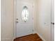 The entryway features wood floors and a white decorative front door with sidelight window at 241 Sanchez Ave, Ormond Beach, FL 32174