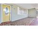 Inviting front porch with decorative tiled flooring and an ornate glass front door, perfect for relaxing at 241 Sanchez Ave, Ormond Beach, FL 32174
