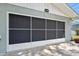 Garage door with a screen panel to allow fresh air while keeping pests out, enhancing functionality at 241 Sanchez Ave, Ormond Beach, FL 32174