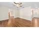Well-lit living room features laminate wood flooring and is adjacent to the kitchen at 241 Sanchez Ave, Ormond Beach, FL 32174