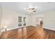 Bright living room featuring wood floors, a ceiling fan, and sliding glass doors at 241 Sanchez Ave, Ormond Beach, FL 32174