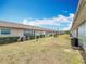 Backyard view of multiple homes, showcasing shared green space and exterior details at 244 Oakleigh Dr # 200, Deland, FL 32724