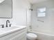 A bathroom featuring a shower, vanity, black faucet and accent mirror at 244 Oakleigh Dr # 200, Deland, FL 32724