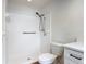 This bathroom includes a walk-in shower with grab bars and a bright light at 244 Oakleigh Dr # 200, Deland, FL 32724
