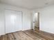 This bedroom offers wood-look floors and a spacious closet with sliding doors at 244 Oakleigh Dr # 200, Deland, FL 32724