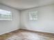 Bright bedroom with modern floors, ample natural light, and a fresh feel at 244 Oakleigh Dr # 200, Deland, FL 32724