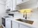 Updated kitchen featuring sleek countertops, modern appliances, and stylish fixtures at 244 Oakleigh Dr # 200, Deland, FL 32724