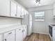 Modern kitchen with white cabinetry, sleek countertops, and a bright window at 244 Oakleigh Dr # 200, Deland, FL 32724