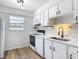 Clean and functional kitchen with bright lighting and neutral color palette at 244 Oakleigh Dr # 200, Deland, FL 32724