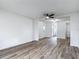Spacious living room with new flooring leading into the kitchen, dining area and slider to the backyard at 244 Oakleigh Dr # 200, Deland, FL 32724