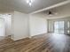 Spacious living room with new flooring leading into the kitchen, dining area and slider to the backyard at 244 Oakleigh Dr # 200, Deland, FL 32724