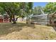 Enjoy the screened pool, shed, and mature trees in this large backyard at 2468 Scottville Ave, Deltona, FL 32725