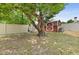 Enjoy outdoor living with a shed and comfortable swing under a mature tree at 2468 Scottville Ave, Deltona, FL 32725