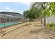 This backyard features a screened pool, shed, fire pit and a privacy fence at 2468 Scottville Ave, Deltona, FL 32725