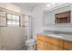 Modern bathroom with a glass-enclosed shower, tiled walls, and updated fixtures at 2468 Scottville Ave, Deltona, FL 32725