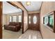 The foyer has tile floor, a decorative wooden door, and entry to the living room at 2468 Scottville Ave, Deltona, FL 32725