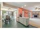 Spacious kitchen with bar seating, breakfast nook, and views into the Gathering room with brick fireplace at 2468 Scottville Ave, Deltona, FL 32725