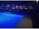 Inviting backyard pool with ambient lighting for evening relaxation and entertainment at 2468 Scottville Ave, Deltona, FL 32725