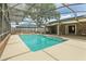 A screened-in swimming pool that features a brick deck and privacy fence at 2468 Scottville Ave, Deltona, FL 32725
