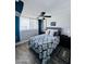 Comfortable bedroom with a city view, ceiling fan, and wood flooring at 2727 N Atlantic Ave # 602, Daytona Beach, FL 32118