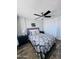 Bedroom features a queen bed, ceiling fan, and closet space for storage at 2727 N Atlantic Ave # 602, Daytona Beach, FL 32118