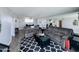Comfortable living room featuring two couches, wood floors, and a mirrored wall at 2727 N Atlantic Ave # 602, Daytona Beach, FL 32118