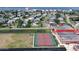 Aerial view of tennis courts and athletic fields near residential area at 2727 N Atlantic Ave # 602, Daytona Beach, FL 32118