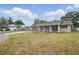 Charming single-story home with a well-maintained front lawn and an attached garage at 290 Greenwood Cir, Ormond Beach, FL 32174